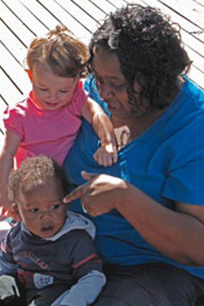 Liberty Community Children's Center - a woman with two children