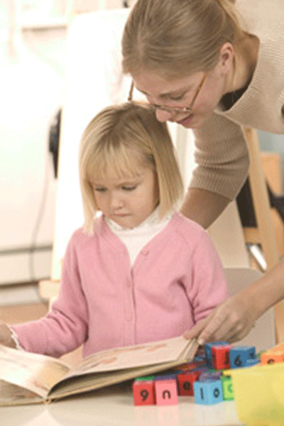 Preschool and daycare education: woman with child